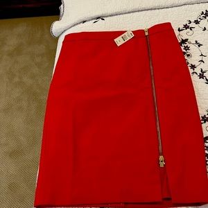 Bran new reddish/ orange skirt.   Nice zipper in the front.